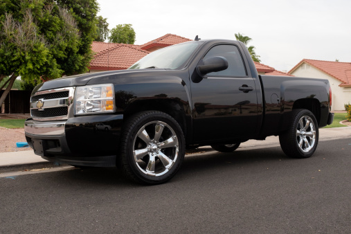 Mesa, United States - July 1, 2013: A close up photo of a black Chevrolet Silverado. The Silverado is a very popular American made truck that competes with Ford's F150.