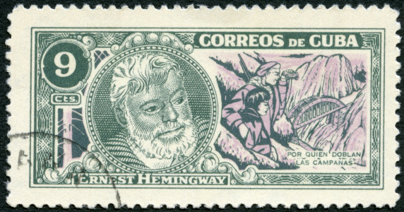 St-Petersburg, Russia - March 17, 2013 A 1963 December 5 Cuba postage stamp shows Ernest Hemingway (1899-1961), Nobel Prize-winner for Literature, \