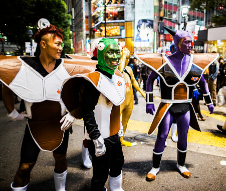 Tokyo, Japan - October 27, 2012: People dressed in costumes as superheroes during Halloween in Shibuya Tokyo Japan. With 15 square kilometer and a resident population of more than 200000 people it has become one of the best shopping districts of the city specially for young people. It has also a lively nightlife and the streets are busy until late at night. Shibuya is also worldly know by the scrambling crossing in from of the train station and it categorized as the busiest street crossing in the world. Although Halloween has not been celebrated in the past in the latest years the popularity of this celebration is spreading quickly in Japan specially among young people.