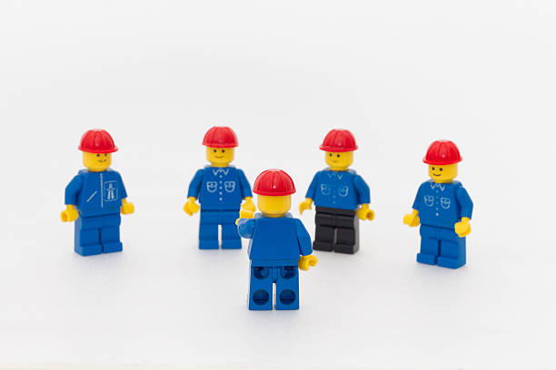 team leader - lego figurine men isolated stock-fotos und bilder