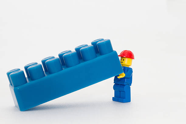 teamwork (teamarbeit) - lego construction toy isolated on white isoalted stock-fotos und bilder