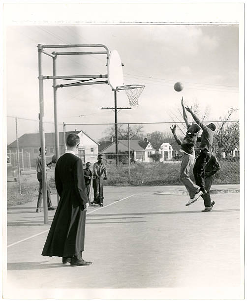 A basketball court is a flat, rectangular playing surface marked with boundary lines, a center circle, free-throw lanes, and three-point arcs, featuring two hoops with backboards at either end
