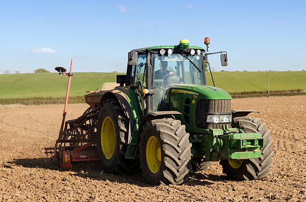 Seed drilling, tractor planting crops stock photo