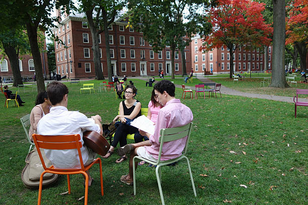 College-aged men and women having a discussion stock photo