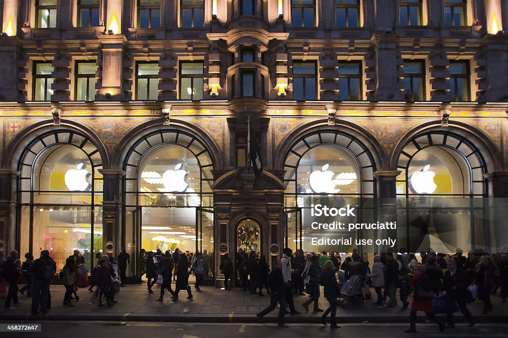 Apple store in London London, UK - November 2, 2013: People stroll in front of the Apple Store in Regent's Street, one of the main shopping areas within Inner London. London - England Stock Photo