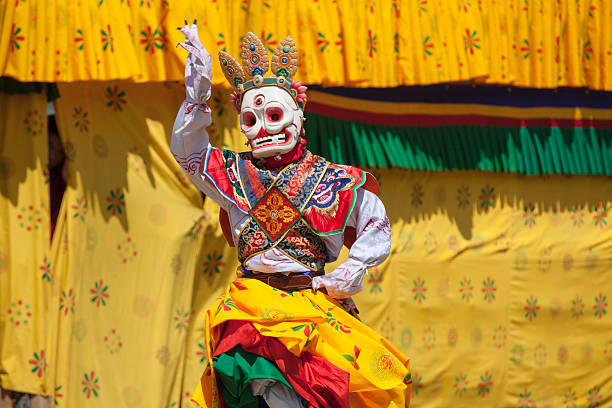 Costumed monk performs traditional dance at Festival of Wangdi. stock photo
