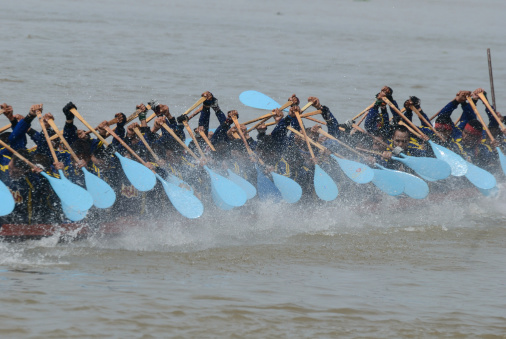 Nonthaburi, Thailand - November 6, 2010: Long Boat Racing for the Kingaas Cup, with a crew of 55 paddlers on each boat.