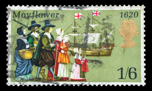 Yateley, Hampshire, UK - September 28, 2012: Commemorative mail stamp printed in the UK featuring the sailing to America in 1620 of the Pilgrims from Britain onboard the Mayflower ship. Stamp issued circa 1970