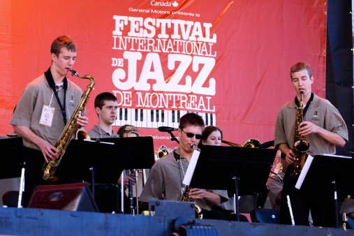 Montreal, Canada - July 6th, 2005: Young talents play saxophone on the stage at the Montreal Jazz Festival.