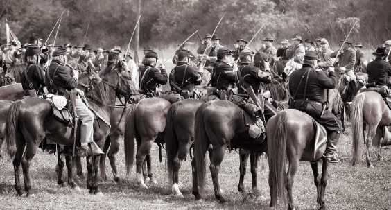 Sharpsburg, Virginia, USA - September 16, 2012: Union and Confederate Cavalry soldiers salute eachother during the 150th Anniversary reenactment of the battle of Antietam. The actual battle occurred on September 17th, 1862 where during the bloodiest day in American history, over 23,000 combatants lost their lives.