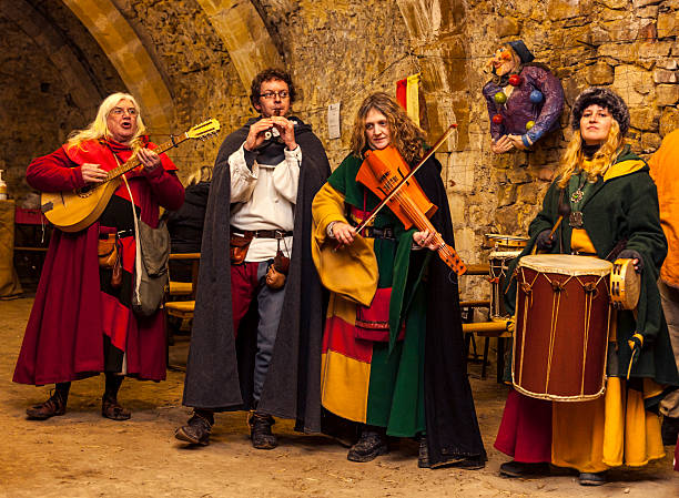Medieval Band Rodemack,France- December 09, 2012:Medieval band playing indoor in the cellar of the former castle, during a historical reenactment festival in Rodemack, France. troubadour stock pictures, royalty-free photos & images