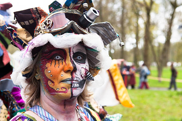 Woman with painted face wearing goggles at Fantasy Fair stock photo