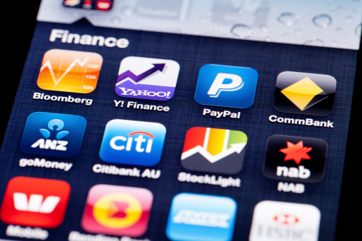 Adelaide, Australia - July 5, 2013: Close-up image of an iPhone 4 screen with icons of finance apps