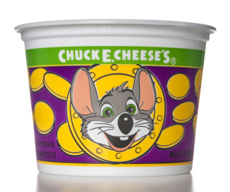 Miami, USA - July 13, 2013: Chuck E Cheese's Token Cup. Chuck E. Cheese a chain of family entertainment centers is the main brand of CEC Entertainment, Inc.