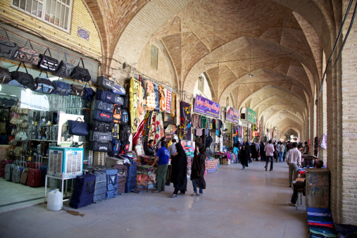 Kerman, Iran - October 13, 2013: People in Ganj Ali Khan bazaar. The Bazaar was Constructed in the 16th century AD during Safavid Dynasty
