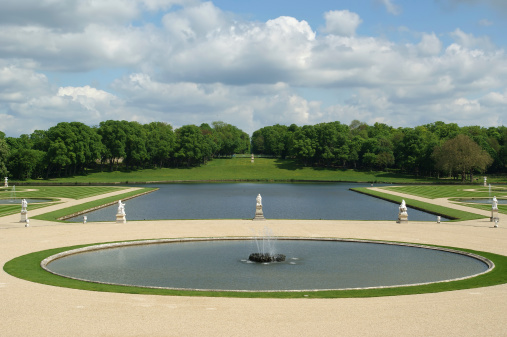 Chantilly, France- May 12, 2012: Chateau de Chantilly ( Chantilly Castle ), located in the town of Chantilly, France. The Chateau consists of two buildings: Petit Chateau (built in 1560) and Grand Chateau (was destroyed during the French Revolution and rebuilt in 1870). The Chateau is Musee Conde - one of the best art galleries in France