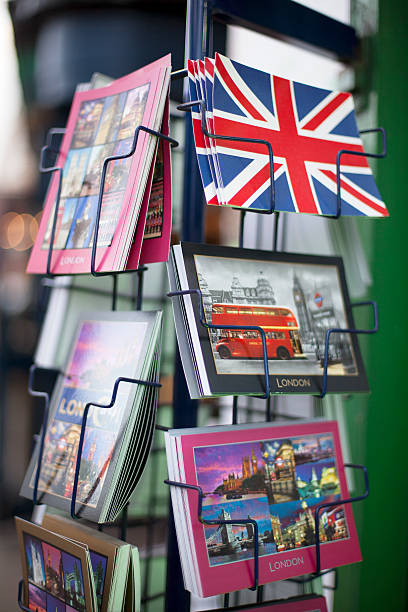 London Postcards London, United Kingdom, January 21th, 2012, Typical London postcards of The Union Jack flag, Big Ben tower, and red double-decker buses and many palces of intrest around London on postcard stand at Greenwich park, East London. London Memorabilia stock pictures, royalty-free photos & images