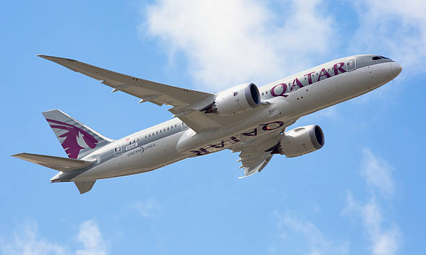 Farnborough, Hampshire, United Kingdom - July 10th, 2012: A Boeing 787 Dreamliner operated by Qatar Airways takes to the skies