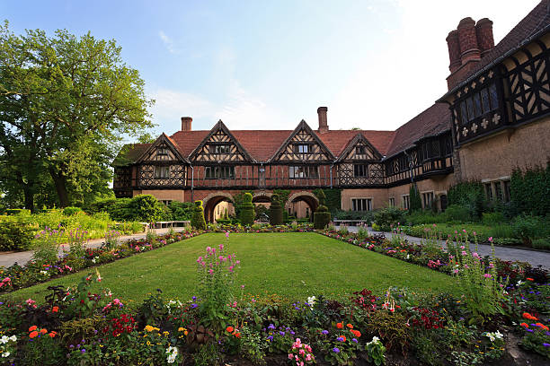 Potsdam, Germany - June 18, 2013: View of Cecilienhof Palace and beautiful garden located at Potsdam, Germany. This place is the location of  Potsdam Conference between 17 July and 2 August 1945 after the World War II.