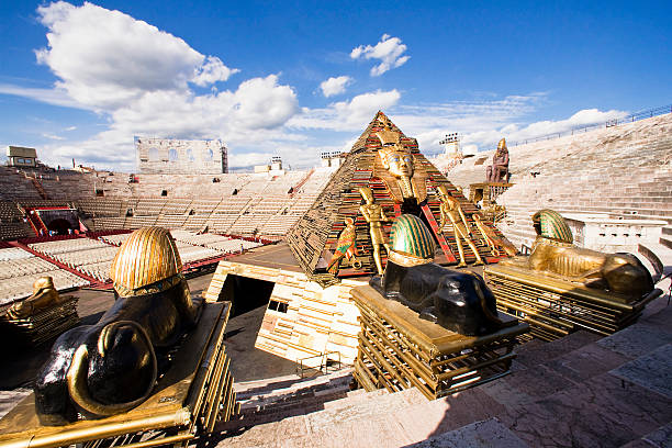 Amphitheater Arena of Verona Verona, Italy - August 29, 2010. The Verona Arena is a Roman amphitheater in Verona's historic center, which takes place every summer, the Festival of Opera. In this context it is portrayed the Egyptian pyramid that are part of the scenario Aida by Giuseppe Verdi, directed by Franco Zeffirelli verona opera stock pictures, royalty-free photos & images