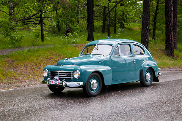 Stockholm, Sweden - june 03,2012:A fully restored Volvo PV 444 from 1930, in a classic car cavalcade around the small island DjurgAYrden on the public road in Stockholm Sweden