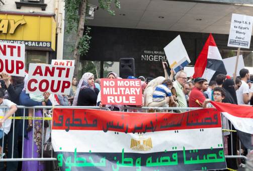 New York, USA - August 16, 2013: Egyptian New Yorkers protest against bloodshed following military coup in support of President Morsi in front of Egypt consulate on August 16, 2013 in New York City