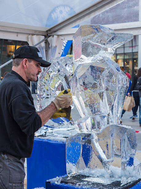 eisskulpturen im sculpture festival - ice carving sculpture chisel stock-fotos und bilder