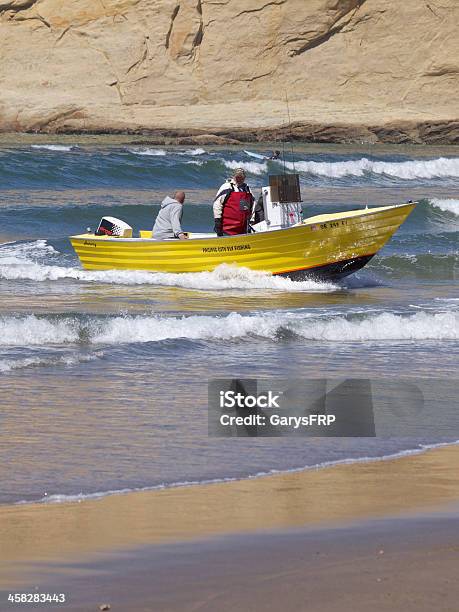 Dory Boat Returning In Surf Cape Kiwanda Pacific City Oregon Stock Photo - Download Image Now