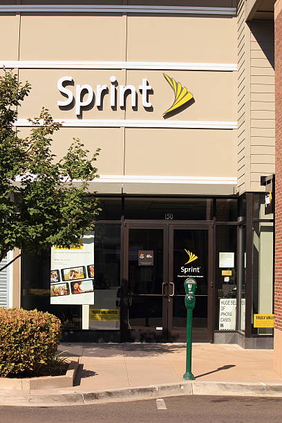 Sprint Store Westminster, U.S.A. --  September 8, 2012:  The exterior of a Sprint retail building.  The logo and sign are located on the entrance door and larger above the door on the buildings face. Advertisements for Sprint are in the windows. sprint nextel stock pictures, royalty-free photos & images