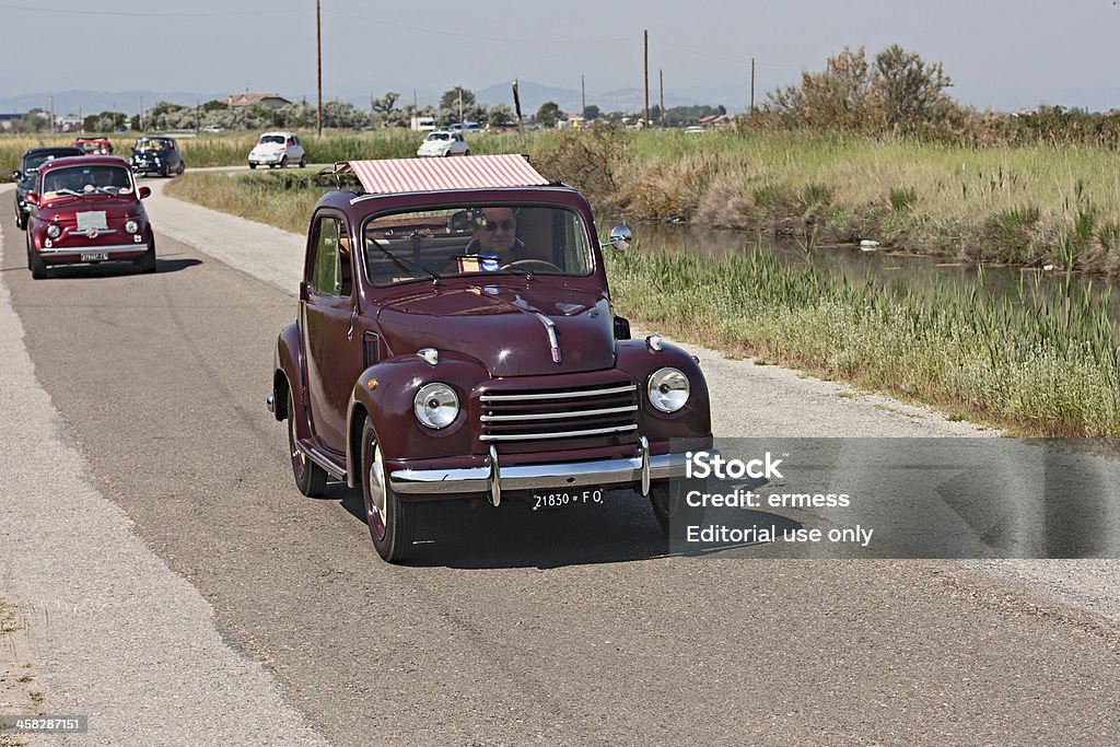 Fiat 500 Mickey Mouse Cervia (RA) Italy - June 2, 2012: unidentified driver on an old italian car Fiat 500 Topolino with canvas sunroof showing at "10! Raduno delle Centurie Romane", rally of vintage cars Vintage Car Stock Photo