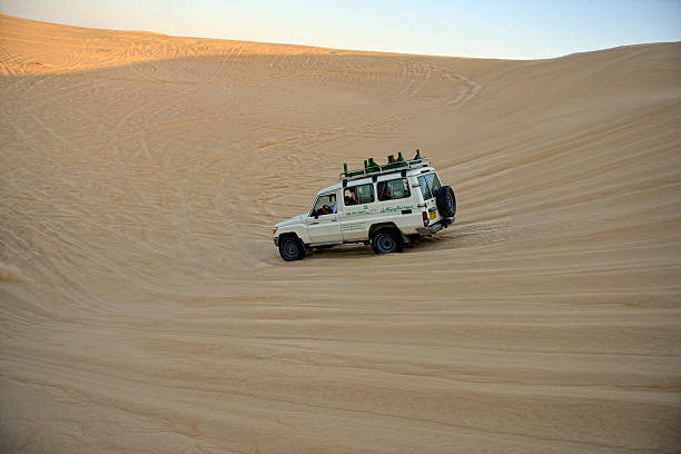 Nawan , Saudi Arabia  Jan 7 2023: 4x4 cars drift across Saudi Arabias striking sand desert. The vehicles perform thrilling maneuvers, on sand dunes