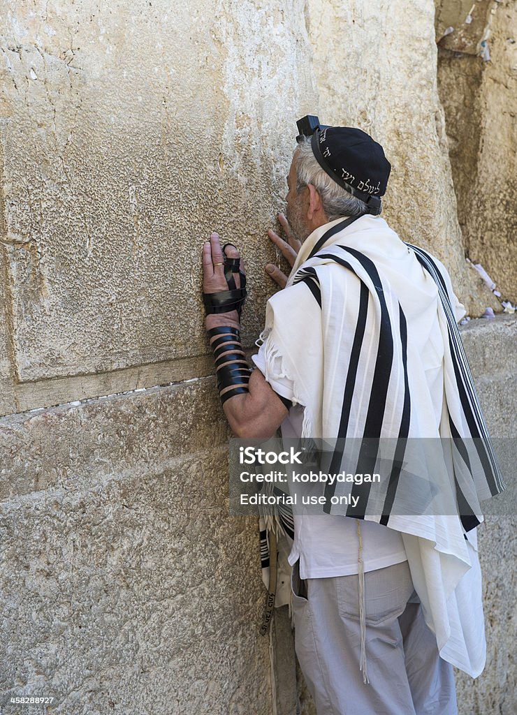 Tisha B'av Jerusalem , Israel - August 8, 2012: Jewish man prays in the Wailing wall during the Jewish holyday of Tisha B'av Tefillin Stock Photo