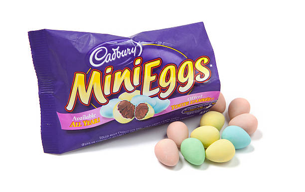 Open Bag of Mini Eggs Chocolate Candy Toronto, Canada - May 10, 2012: This is a studio shot of Mini Eggs chocolate candy made by Cadbury isolated on a white background. cadbury plc photos stock pictures, royalty-free photos & images