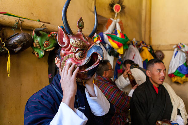 Buthanese man with traditional mask for fire festival in Thangbi stock photo