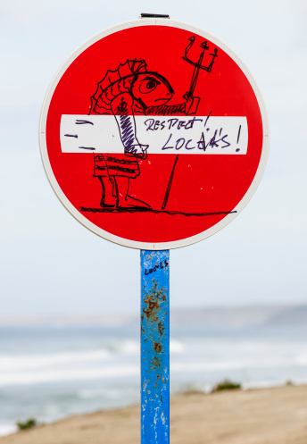 Lourinha, Portugal - October 22, 2012: No Entry traffic Sign at Peralta Beach with by hand drawn art claiming respect for local surfers.