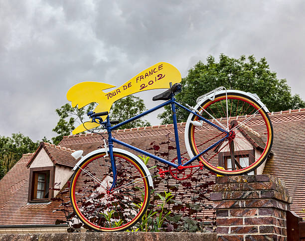 Fontenay-sur-Eure,France-July 20, 2012: A funny mascot of a cyclist, decorating a fence in front of a house from a small French village, one day before the passing of the peloton in the 19th stage of Le Tour de France 2012, a time trial between Bonneval and Chartres.