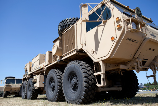 Arlington, United States - July 13, 2013: This image shows a low angle view of a very large 4 axle military vehicle on public display.