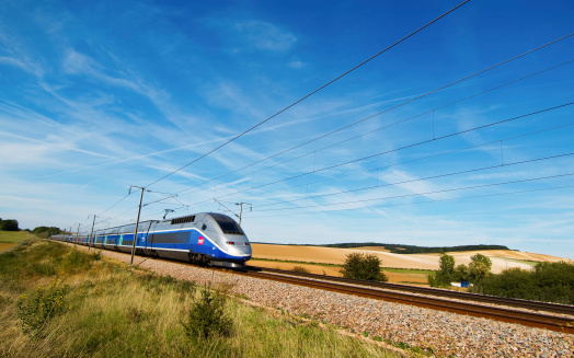 Sens, France - 15 September: A french high speed train passing through a field.