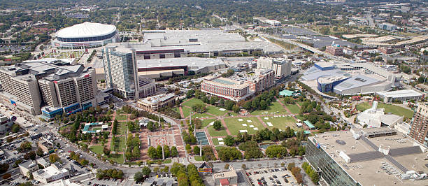 Centennial Olympic Park Area of Atlanta, Georgia Atlanta, Georgia, USA - October 12, 2012: Aerial view of Atlanta Georgia overlooking Centennial Olympic Park area.Picture shows the Georga Dome, CNN Center, Omni Hotel, Georgia World Congress Center, Georga Aquarium, World of Coca Cola, Centennial Olympic Park  and headquarters of the American Cancer Society georgia football stock pictures, royalty-free photos & images