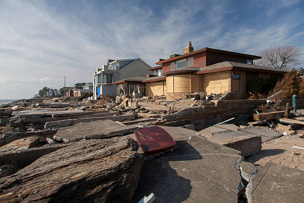 Sandy's Aftermath USA, New York - November 12, 2012:Pile of garbage, debris near flooded and damaged house after Hurricane Sandy on Manhattan Beach on November 12, 2012, Brooklyn, NY superstorm stock pictures, royalty-free photos & images