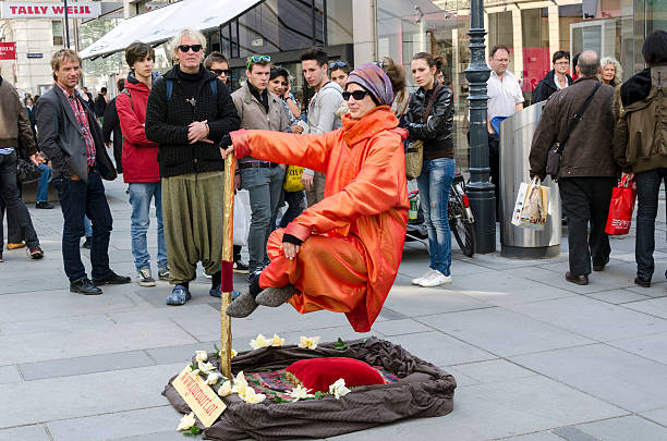 Madrid, Spain - May 24, 2017: A 'Charlie Chaplin' street performer in Puerta del Sol, downtown Madrid. In this area attracts many performers of various kinds, who are very popular with the crowds of tourists who throng to the Square daily. Charlie Chaplin was an English comedy actor and film director who was at the height of his fame during the silent film era.