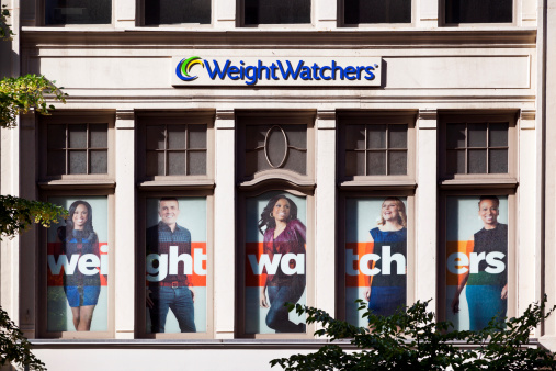New York City, USA - June 17, 2013: The facade of the Weight Watchers Store in Chelsea on 23rd Street. Weight Watchers International, founded in 1963 by Jean Nidetch and based in the US, is the world's leading provider of weight loss and maintenance, operating globally through a network of company-owned and franchise operations in about 30 countries around the world.
