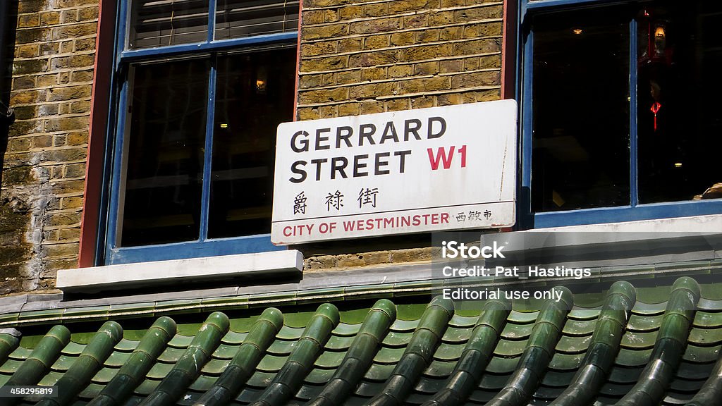 Chinatown. London. United Kingdom London, United Kingdom - July 22, 2013: Gerrard Street sign in English and Chinese. Chinatown. Soho District. Bilingual Stock Photo