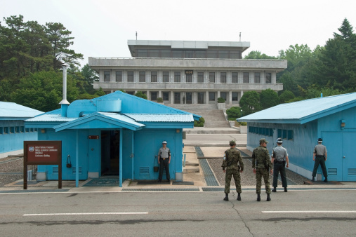 Panmunjom, South Korea aa June 8, 2012: South Korean Soldiers in DMZ watching border between South and North Korea in Panmunjom, South Korea.