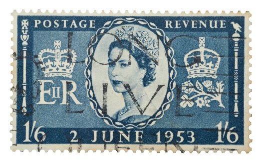 Yateley, Hampshire, UK - September 28, 2012: Isolated Queen Elizabeth II mail stamp printed in the UK to celebrate her coronation to the British and Commonwealth throne on June 2, 1953.