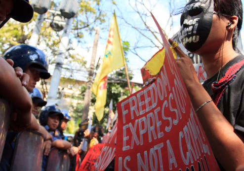 Manila, Philippines - January 15, 2013: The Philippine Internet Freedom Alliance (PIFA) and other groups including Bayan Muna, Piston, and Gabriela held a silent protest near the Supreme Court in Padre Faura, Manila to petition against RA 10175, a Cybercrime Prevention Act. The bill which was temporarily restrained for the last three months for allegedly violating some constitutional rights of the people.