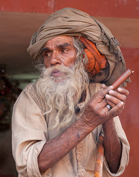 Blowing pilgrim at Kumbh Mela in Haridwar stock photo