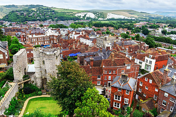 Lewes, England - August 17, 2013: Aerial view of Lewes and the South Downs   in East Sussex, England. Old Norman castle on the left. Built of Flint. Background people.
