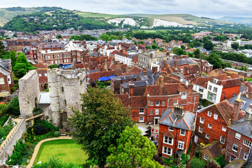 Lewes, England - August 17, 2013: Aerial view of Lewes and the South Downs   in East Sussex, England. Old Norman castle on the left. Built of Flint. Background people.