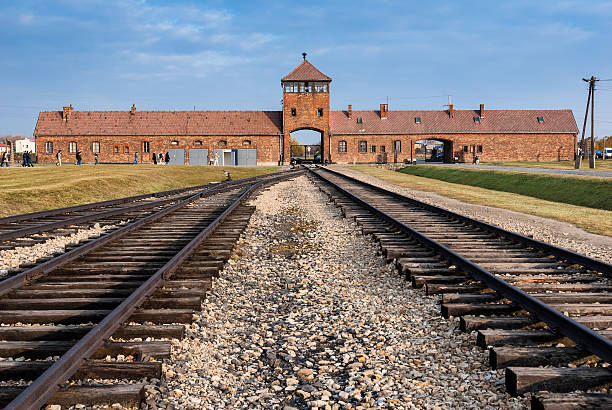 Auschwitz Museum Oswiecim, Poland - October 28, 2007: The entrance of the notorious Auschwitz II-Birkenau, a former Nazi extermination camp and now a museum on October 28, 2007 in Oswiecim, Poland concentration camp photos stock pictures, royalty-free photos & images